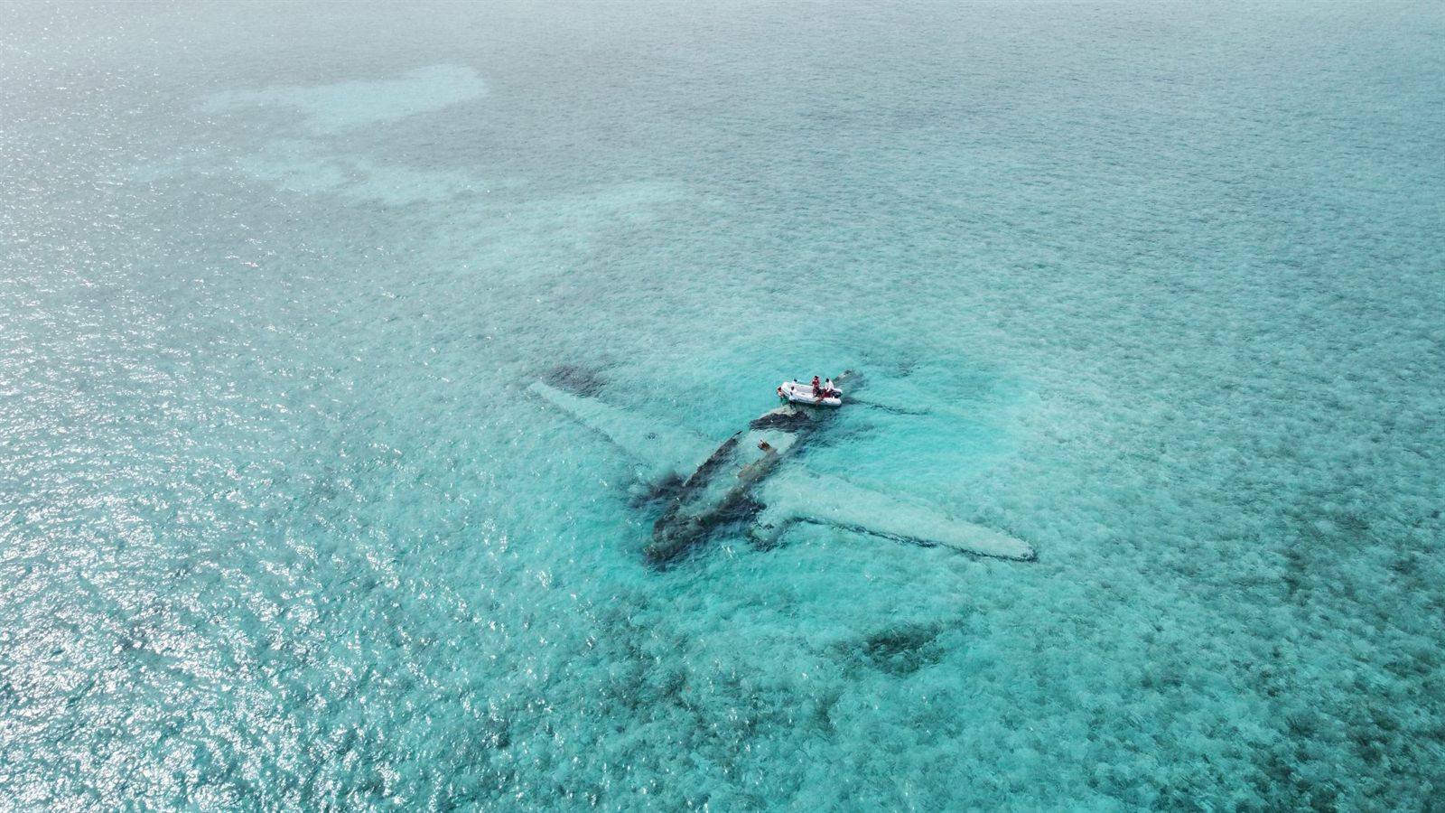 Sunken plane wreck in shallow water off Normans Cay, Exumas