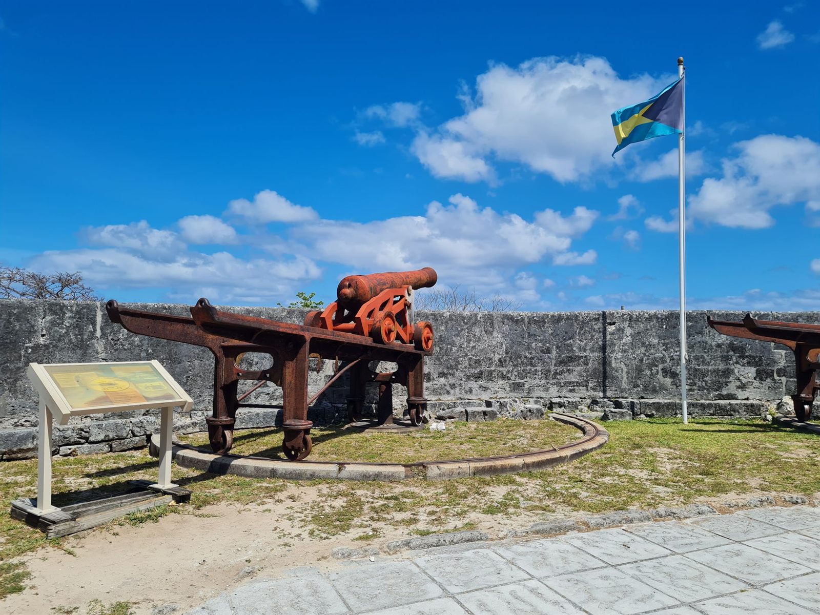 Historic cannons and the Bahamian flag at Fort Charlotte, Nassau